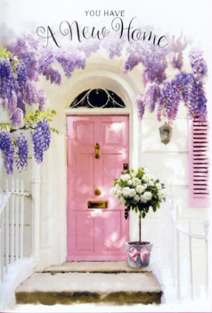 In this serene doorstep scene, typical of a lovingly kept home near Queen's Park station, a pastel pink door becomes an emblem of welcome and hope. The door's surface is painted in a velvety, chalk-soft blush tone that almost seems to hold the light, creating a subtle glow against the crisp, whitewashed façade. Just to one side, a matching shutter picks up the same whisper of colour, visually linking the architecture to the floral palette below. Overhead, mature wisteria has been trained along the wall and lintel, yet still tumbles with free-spirited abundance; long, trailing clusters of lilac and lavender blossoms hang like soft curtains, interlaced with emerald-green leaves that catch the breeze. The blooms are dense enough to cast delicate, mottled shadows on the door and doorstep, as though the afternoon sun is filtering through a living lace canopy. At ground level, a florist's bucket made from brushed grey metal sits firmly on the stone step, its cylindrical shape giving structure to the arrangement it holds. From this vessel, white and cream roses rise in generous profusion, their petals tightly layered at the centre and gently unfurling at the edges to form cushioned rosettes. The roses are accompanied by tufts of fresh green foliage and perhaps a hint of silvery, eucalyptus-like leaves, which break up the ivory tones and introduce a natural movement to the composition. A pale pink ribbon, carefully tied around the bucket, provides a final, graceful accent, the bow's tails lying softly against the metal. The scene feels both composed and effortless, like a housewarming gift delivered earlier in the day and left ready to greet its new owners as they return. It suggests the tenderness of congratulations, the excitement of carrying boxes through that doorway, and the comforting idea that flowers can make any new address, from a flat near Brondesbury Park to a townhouse off Salusbury Road, feel instantly like home.