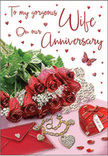 This image presents an intimate anniversary card setting that feels as though it belongs on a cosy sideboard in a Queen's Park townhouse. A compact, fragrant-looking bundle of red roses dominates the foreground, their petals rich and velvety with subtle highlights catching the light, each bloom opened just enough to show its swirling centre. Fresh greenery cradles the roses, the leaves offering a crisp contrast that suggests they were recently trimmed and arranged with a florist's steady hand. Slightly behind and beside the flowers rests a pale envelope and card, their edges clean and smooth, hinting at a heartfelt message written within. A small, heart-shaped box in glossy crimson is placed nearby, its surface reflecting tiny points of light, while a delicate piece of jewellery lies beside it, perhaps a necklace or pendant, its metallic sheen soft but noticeable. Scattered across the surrounding area are miniature hearts and sparkling accents, like tiny gems or sequins, bringing a sense of quiet festivity to the design. A single butterfly motif appears amidst the hearts, adding a gentle, whimsical touch, as though love itself has taken flight. The backdrop and base have a slight shimmer, suggesting polished card or a reflective surface, while the overall lighting feels like gentle afternoon sun drifting in from a nearby window facing the park. Together, these elements create a warm, romantic scene that mirrors the feeling of sharing an anniversary evening at home in NW6, with roses, keepsakes, and words of love carefully laid out for someone special.